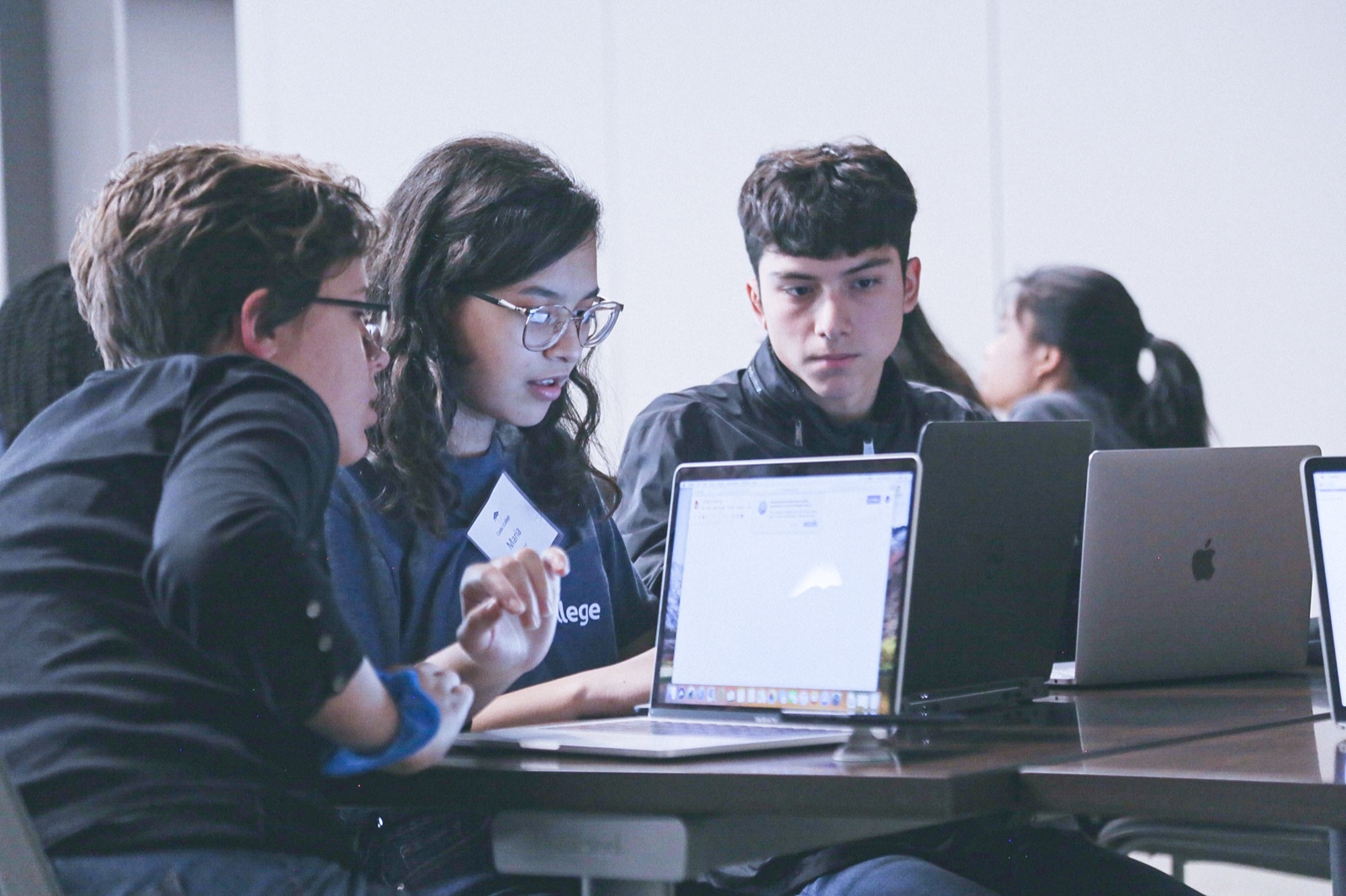 Code2College students collaborating on a project